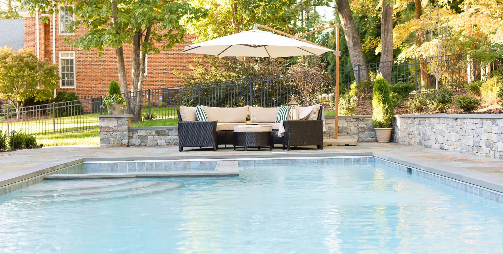 Pool with hot tub and bluestone patio