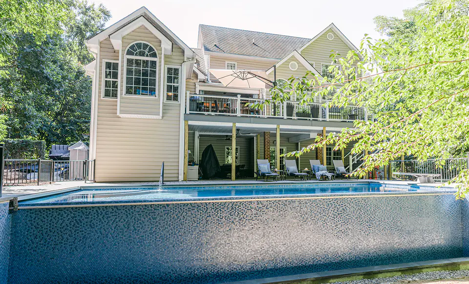 pool with house in backyard