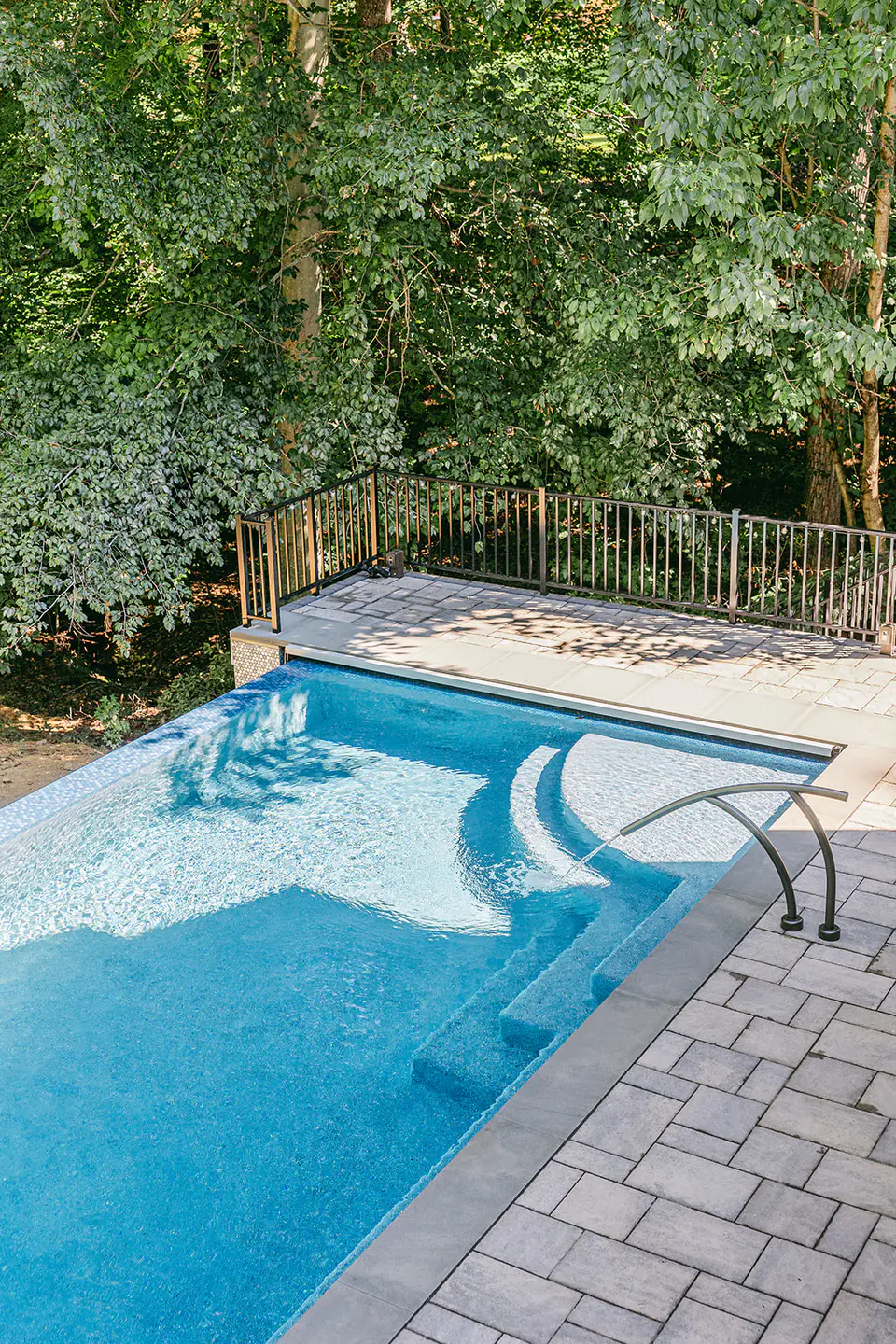 custom built outdoor pool with infinity edge